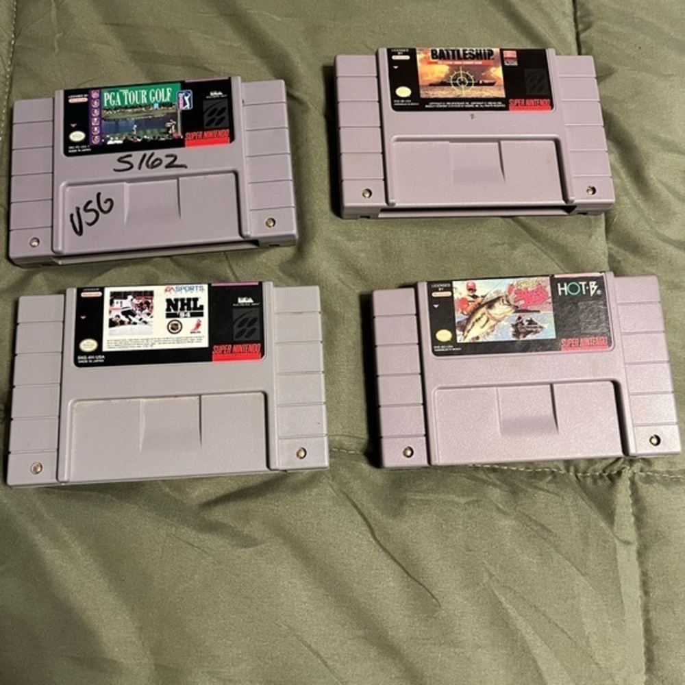 Super Nintendo set of four games battleship, nhl, bass , golf description in pic